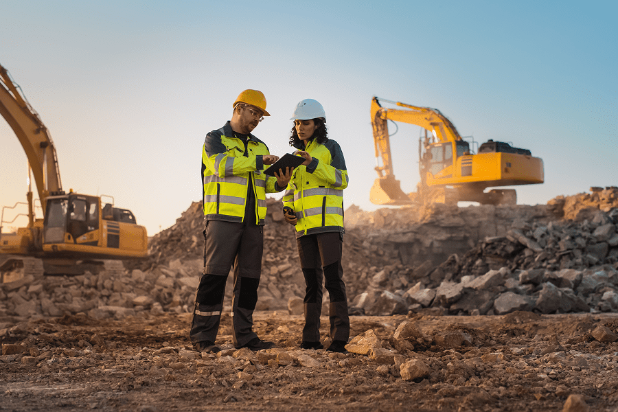Construction workers discussing at a site